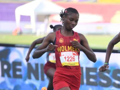Wolmer’s Trust High School for Girls’ Natrece East cruises into the semi-final of the 100 metres on day one of the ISSA/GraceKennedy Boys and Girls’ Athletics Championships at the National Stadium yesterday.
