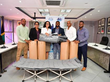 Lisa Lake, group chief executive officer of Restaurant Associates Limited (RAL), and Michael Lake, director, are joined by the Mayor of Montego Bay, Richard Vernon, and representatives of the St James Municipal Corporation during the official handover of 1