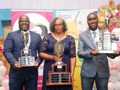 Dorette Rhoden Henry, teacher of deCarteret College and the 2025 LASCO, Ministry of Education, Skills, Youth and Information, Jamaica Teaching Council Teacher of the Year, with Orville Anthony Richards (left), principal of St Mary Technical High School, an