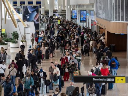 Travellers wait in a TSA line, Wednesday, March 25, 2026, at LaGuardia Airport in New York. (AP Photo/Yuki Iwamura)