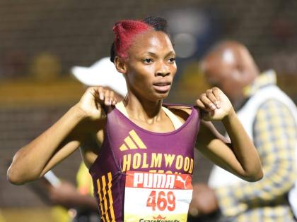 Jovi Rose of Holmwood Technical celebrates after winning the Class One girls’ 1500 metres at the ISSA/GraceKennedy Boys and Girls’ Athletics Championships at the National Stadium on Wednesday.