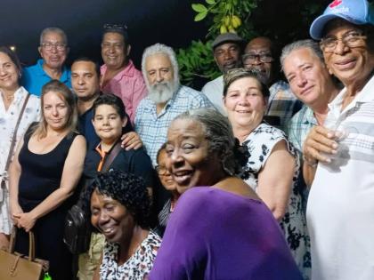 A group of Cubans doctors pose for a photo at a farewell get-together.