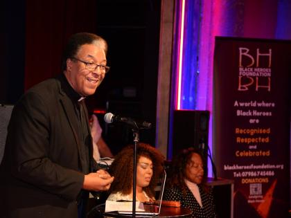 Rev Michael King, trustee of the Black Heroes Foundation, addresses the audience during the BHF Windrush Day concert in 2024