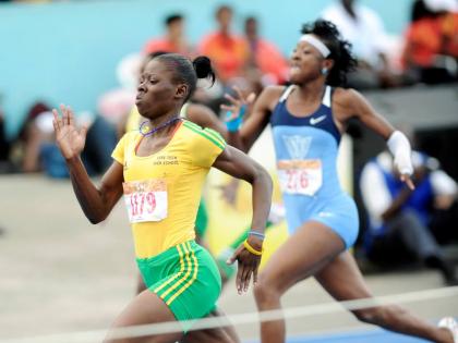 Shericka Jackson of Vere Technical High wins  Class One 200 metres at Champs 2013.  