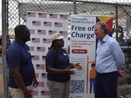 Scott Renner (right), United States Embassy chargé d’affaires in Kingston, is provided with an update on the Hope Mobile Clinic in Barrett Town, St James, by Dr Didinu Tamaklor, country director for Project Hope, and Kamesha Kelly-Swaby, emergency respo