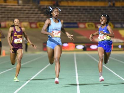 Kelly Ann Carr (centre) from Edwin Allen High  wins the Class One  400 metres in  52.20 seconds on Thursday ahead of Nastassia Fletcher (right) from Hydel High, 52.48 and Abrina Wright (left) of Holmwood Technical who was third in 52.81. 