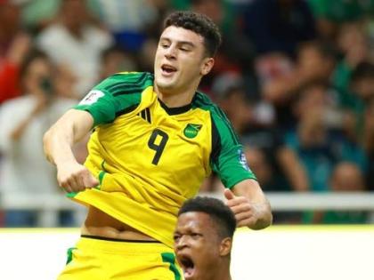 Goalscorer Bailey Cadamarteri (left) and defender Richard King celebrate after Jamaica took the lead against New Caledonia during their FIFA World Cup intercontinental playoff match in Guadalajara, Mexico on Thursday night. Jamaica won 1-0.