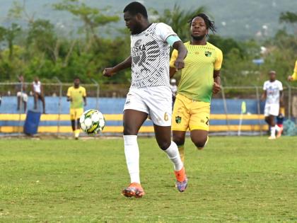 Cavalier SC’s Jeovani Laing (left) tries to keep the ball away from Treasure Beach FC’s Naqwan Henry during a Jamaica Premier League match at the St Elizabeth Sports Complex on March 15.