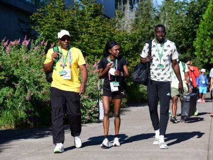 
From left: Coach Lennox Graham, middle-distance runner Natoya Goule, and 400m hurdler Kemar Mowatt.