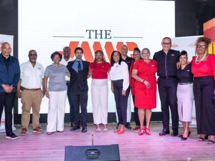 The JMMB Group team poses for a photo at the recently held client mixer Cocktails and Conversations at S Hotel, Montego Bay.