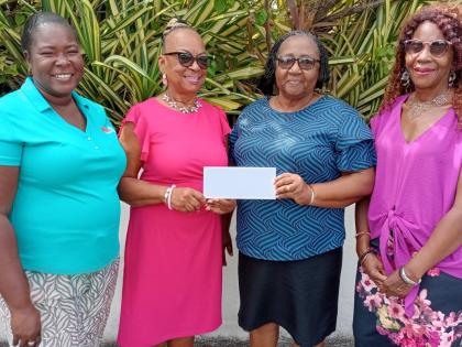 Vana Taylor (second left), chairman of the Jamaica Hotel and Tourist Association Ocho Rios Runaway Bay Chapter, hands over a cheque for $150,000 to Gwendolyn Howell, administrator at Widow’s Mite, as an annual charitable donation, while Cherile Thompson 