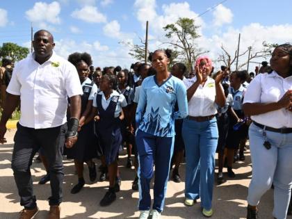 Shanoya Douglas enters the Holland High School grounds in Trelawny to a hero’s welcome following her record-breaking performance at the ISSA/GraceKennedy Boys and Girls’ Athletics Championships on March 30, 2026. (Ashley Anguin photo)