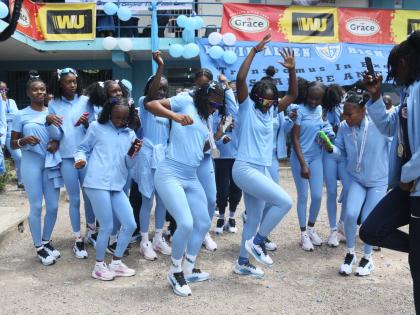 Members of Edwin Allen High’s female track team dance up a storm as they celebrate their victory in the ISSA/GraceKennedy Girls’ Athletics Championships in Frankfield, Clarendon, on Monday.