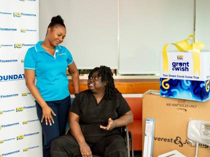 Kadeen Finn-Miller (left), programmes administrator at the NCB Foundation, listens keenly as Bridgette Small, a registered nurse and Grant a Wish beneficiary, shares a reflective moment at the recently held handover.