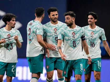 Portugal teammates celebrate a goal against the United States during the first half of an international friendly football match in Atlata, yesterday.