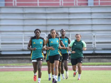 Members of Jamaica’s Reggae Girlz warm up. 