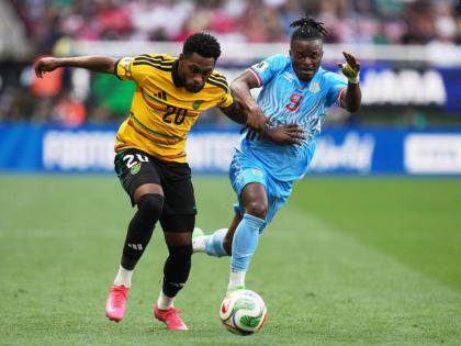 Jamaica’s Renaldo Cephas (left) and DR Congo’s Brian Cipenga vie for the ball during the Intercontinental World Cup Playoff final in Guadalajara, Mexico yesterday.