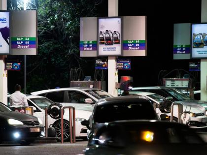 People queue to buy fuel at a petrol station, in Johannesburg, South Africa, Tuesday, March 31, 2026. (AP Photo/Themba Hadebe)