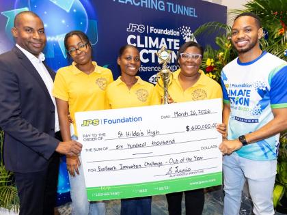 Hugh Grant (left), president & CEO of JPS, and Aundhrae Richardson (right), JPS Foundation officer, pose with representatives of St Hilda’s Diocesan High School, which was named the JPS Foundation Power Up Energy Club of the Year during the JPS Foundatio