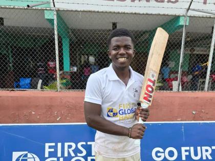 St Jago captain Vitel Lawes is all smiles after leading his side to the First Global Bank Grace Shield title in a game against Campion College at Melbourne Cricket Oval yesterday.