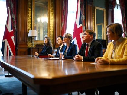 Britain's Foreign Secretary Yvette Cooper, centre, speaks during a virtual summit at the Foreign & Commonwealth Office in London, on Thursday April 2, 2026, with around 35 countries to discuss ways of reopening the Strait of Hormuz. (Leon Neal/Pool Photo v