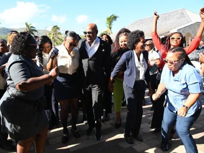 Tourism Minister Edmund Bartlett with tourism workers at the April 2 opening of Half Moon, where he announced that the Tourism Workers Pension Scheme has grown to $6 billion and outlined intentions to introduce a health plan next.