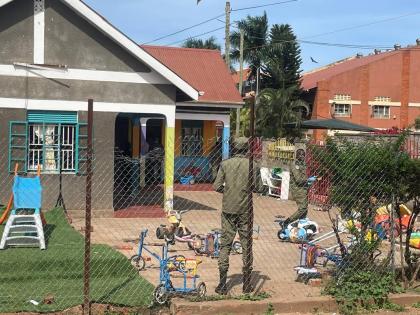 Uganda police officers stand at the crime scene after a man killed four children in a machete attack at the Gaba Early Childhood Development Program nursery school in Kampala, Uganda, Thursday, April 2, 2026. (AP Photo)
