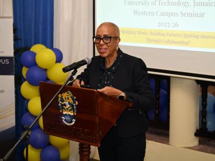 Fayval Williams, minister of finance and the public service, speaking at the University of Technology Western Campus Business Seminar. 