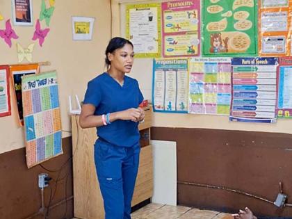 Dental hygienist Shennel Noble speaks to students about oral health during the Santa Cruz Family Dental‑led ‘Sweet Smiles, Smart Choices’ campaign. 