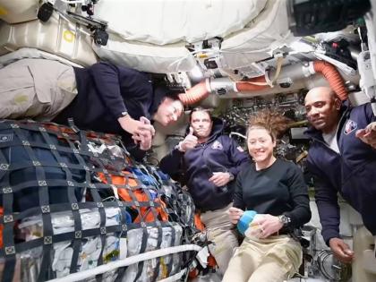 This image taken from video provided by NASA shows the Artemis II crew (from left) Canadian astronaut and mission specialist Jeremy Hansen, Commander Reid Wiseman, mission specialist Christina Koch and pilot Victor Glover, as they speak with NASA Mission C