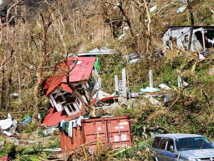 
Homes lay scattered after the passing of Hurricane Maria in Roseau, the capital of the island of Dominica, in September 2017. 