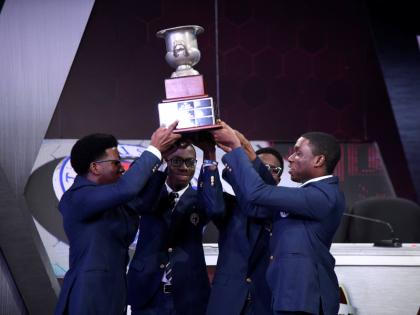 Members of the Jamaica College team celebrate with the Schools’ Challenge Quiz championship trophy after their victory during the grand finale of the 2026 competition on Thursday night at TVJ’s studios in St Andrew. 