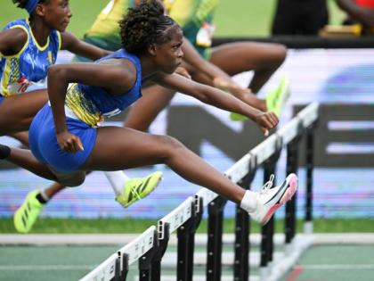 Ricardo Makyn/Chief Photo Editor
Hydel High School’s Keneisha Robinson hurdles on her way to winning the Class Four 70-metre hurdles at the ISSA/GraceeKennedy Boys and Girls’ Athletics Championships inside the National Stadium on March 28. 