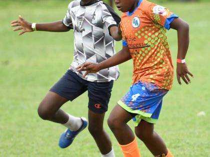 Antoine Lodge/Photographer 
Next Cup action between the black and whites of Kingston Central and Charlton’s Academy at the UWI Mona Bowl yesterday.