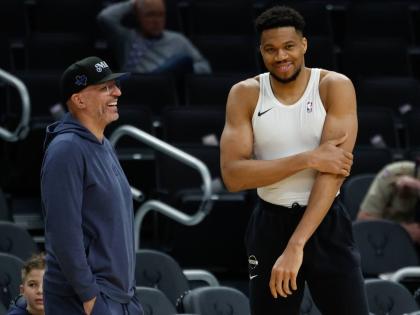 Milwaukee Bucks forward Giannis Antetokounmpo (right)  talks to the Dallas Mavericks head coach Jason Kidd before an NBA basketball game Tuesday, March 31, 2026, in Milwaukee. 