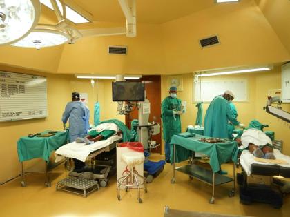 Ophthalmologists operate on two patients during a marathon cataract event, in Tsakane, South Africa.