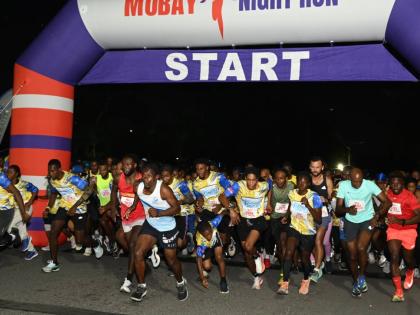 Participants at the start line for the MoBay Night Run 5K Run/Walk on Jimmy Cliff Boulevard in Montego Bay on Saturday. 