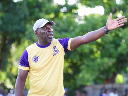 Vassell Reynolds relaying instructions to players during a Kingston College Manning Cup football match.