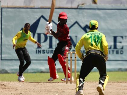 Jamaica under-15 seamer Hugh Turner (left) just before picking up with wicket of K’Hill Thomas as wicketkeeper Daniel Davidson looks on.
