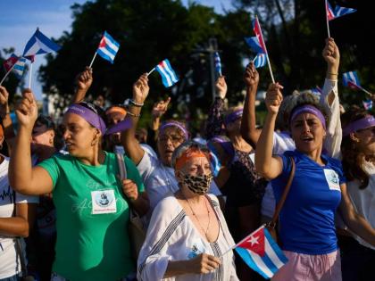 Women attend a rally calling for the end of the US blockade against the island nation in Havana, Cuba, Tuesday, April 7, 2026. 