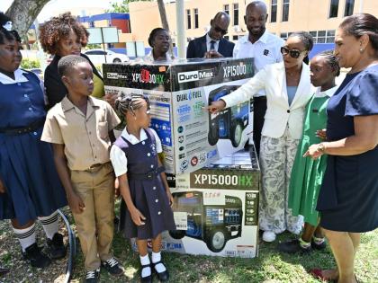 Latoya Harris Ghartey (second left), executive director, National Education Trust (NET); Kennecy Davidson (fifth left), assistant chief education officer; Everette Riley (sixth left), senior education officer for Region 4; Roger Hinds (seventh left), of Ja
