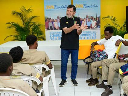 Former Reggae Boyz technical director, Rene Simões, speaks to students at Garvey Maceo High School in Clarendon last year.