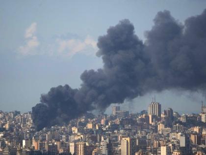 Smoke rises following an Israeli airstrike on a building in Beirut, Lebanon, Wednesday, April 8, 2026. (AP Photo/Hassan Ammar)