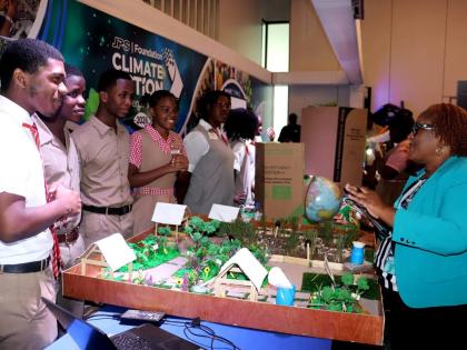 Students show off their project at the recent JPS Foundation Climate Action Conference and Expo held in Kingston.