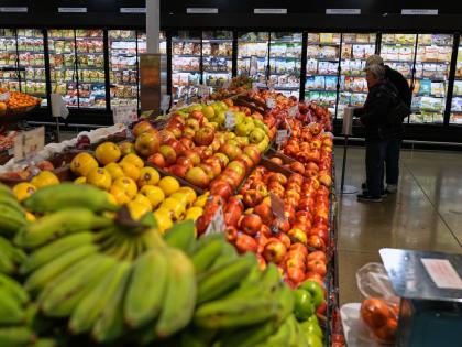 People shop at a grocery store, in Schaumburg, USA, Thursday, April 2, 2026. (AP Photo)
