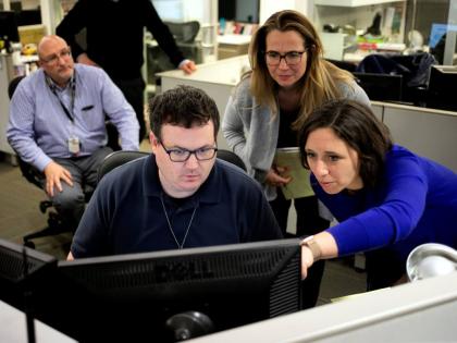 Associated Press Washington Bureau Chief Julie Pace, right, looks over a headline with deputy managing editor for operations David Scott in the newsroom at the Associated Press in Washington, February 5, 2020. (AP Photo)