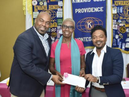 Dr Garfield Badal (right), a consultant paediatric surgeon at the Cornwall Regional Hospital, collects a cheque from Dwight Crawford, deputy mayor of Montego Bay, and Barbara Grizzle, president of the Kiwanis Club of Providence, Montego Bay, valued at $2.7