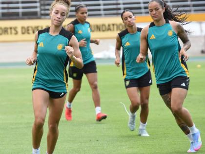 Members of the Reggae Girlz squad go through their paces for their upcoming game against Antigua and Barbuda on Friday.