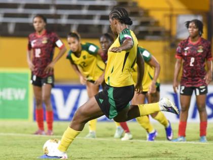 Reggae Girlz Captain, Khadija Shaw, prepares to strike the penalty that opened the scoring for Jamaica on her way to a hat-trick in a 4-0 win over Antigua and Barbuda inside the National Stadium tonight.