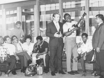 In this 1969 photo, The Mighty Sparrow and his 15-piece calypso band, the Troubadours, are seen at the Palisadoes Airport being received by Patrick Alexander (in suit at centre), entertainment manager of the Courtleigh Manor Hotel. At right is Cyril Shaw (
